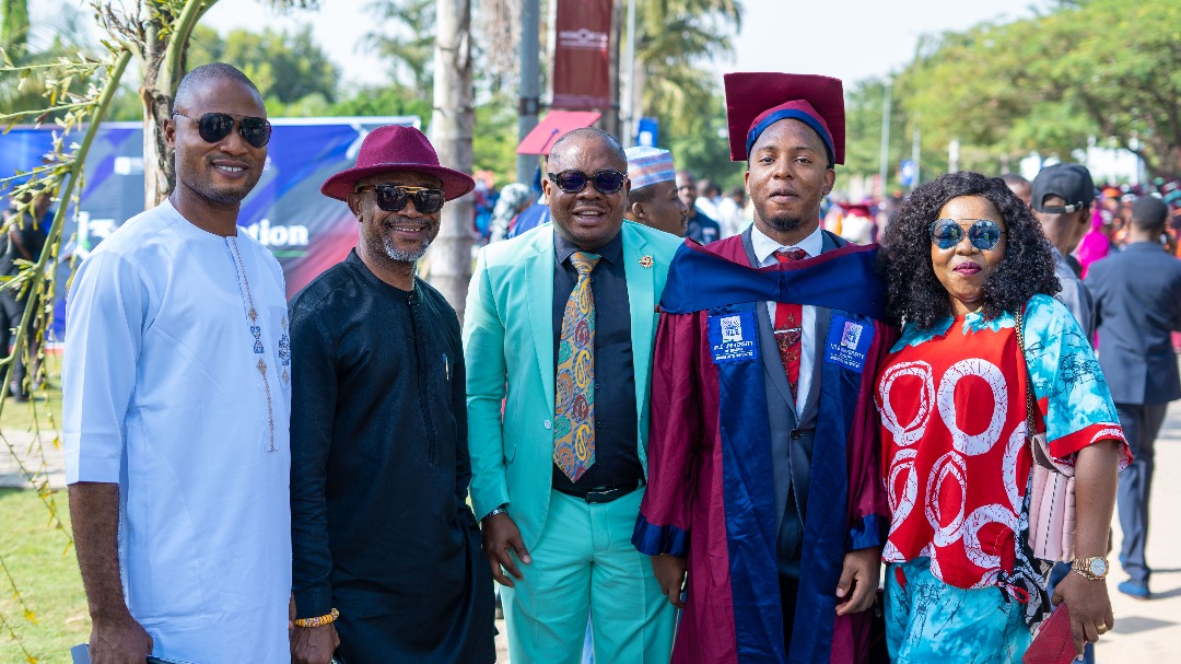 Emmanuel with family members