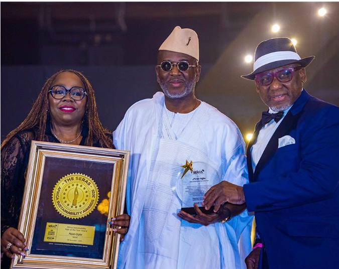 Mr. Ogbe (middle) with the plaque
